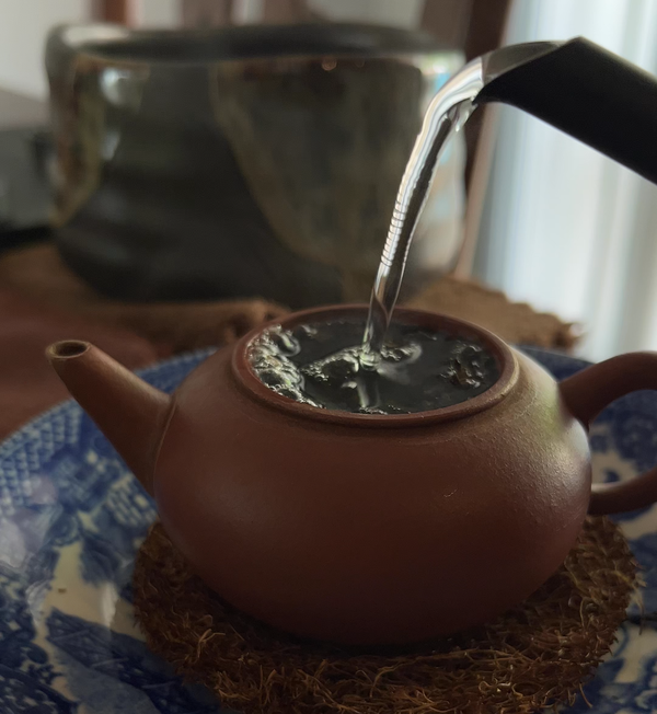 Pouring water into an Yixing teapot